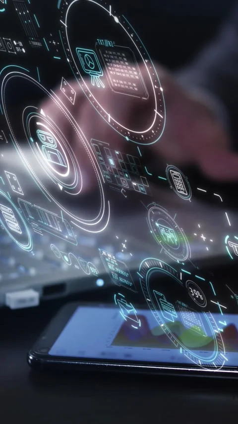 Engaging with a laptop and a 3D holographic display. Stock Footage 329383353