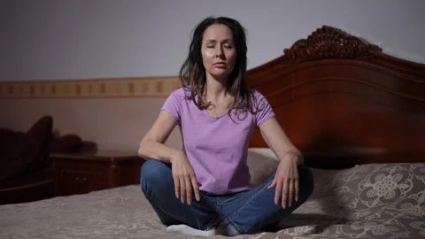 Engaging in a Meditation Session on My Bed A Calm and Reflective Moment  Stock Footage 309383457