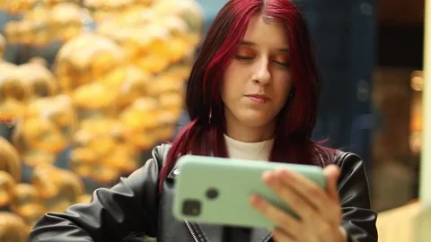 Engaging moment with technology in a vibrant indoor setting Stock-Footage 295268959