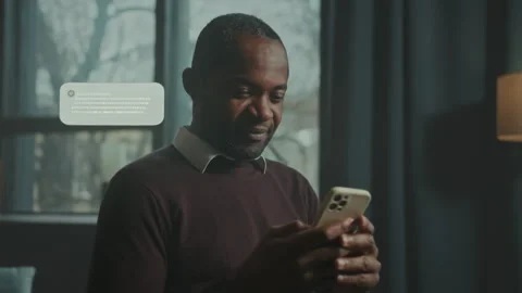 Engaging Moments: Man Interacting with Smartphone Notifications Stock Footage 319496478