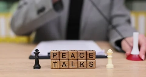 Engaging moments of peace talks with chess pieces and note-taking in a cozy Stock Footage 319647350