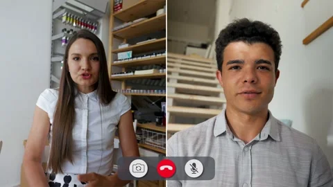 Engaging online discussion between two participants in split screen Stock Footage 310963989