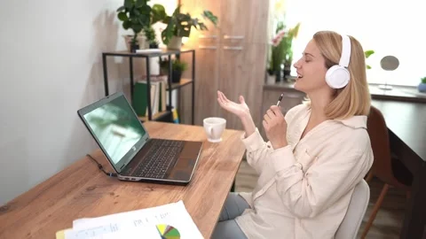 Engaging online learning experience with interactive discussions in a cozy home Stock Footage 303905132