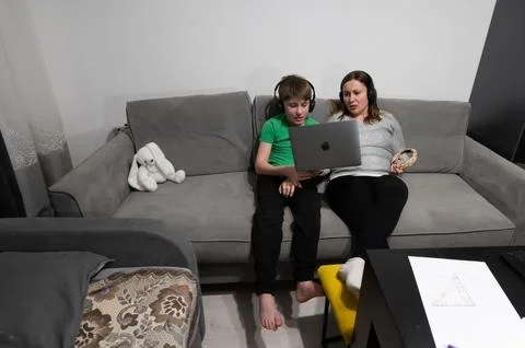Engaging online learning experience shared between a child and a parent in .. Stock Photos