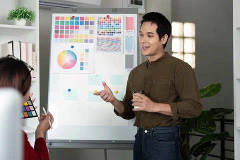 Engaging Presentation and Color Updates. A designer explaining visual elements Stock Photos