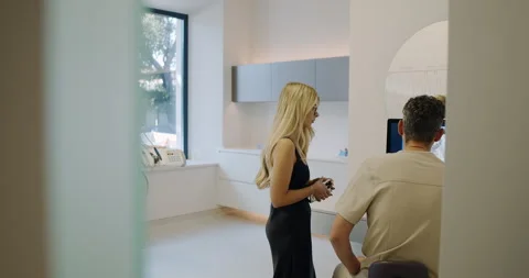 Engaging in Professional Interaction Within a Modern Dental Clinic Environment Stock Footage 318281306