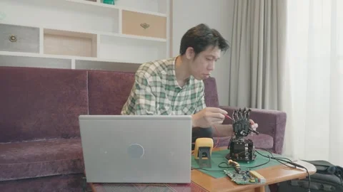 Engaging in Robotics: A Creative Engineering Project Stock Footage 338271682