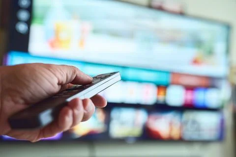 Engaging with a smart TV using a remote Stock Photos