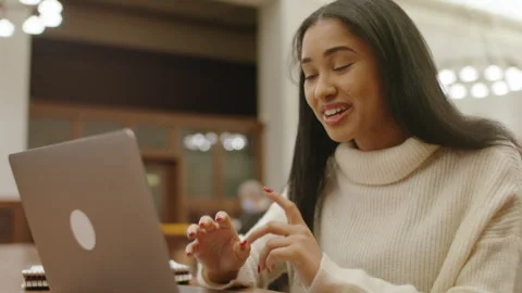 Engaging student video call discussing library resources and collaborations Stock Footage 312769487