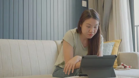 Engaging with Technology: A Cozy Moment at Home Stock Footage 327578053