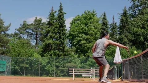 Engaging in a Tennis Practice Session on a Beautiful Sunny Day at the Sports Stock Footage 310411594