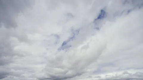 Engaging timelapse showcases the mesmerizing movement of clouds as they dance Video stock 330376682