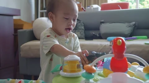Engaging Toddler Playtime Activity in Cozy Living Room Stock Footage 341142388