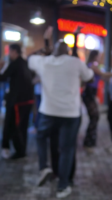 Engaging in a Vibrant Dancing Atmosphere Promoting a Dynamic Nightlife Scene in Stock Footage 296730678