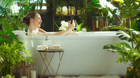 Engaging in Video Call from a Luxurious Bath Stock Footage 336352064