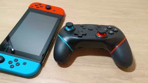 Engaging video showcasing the excitement of portable gaming with a colorful Video stock 318310916