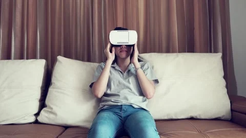 Engaging in Virtual Reality Experiences at Home Stock Footage 314636723