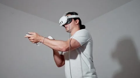 Engaging in a Virtual Reality Gaming Experience that is full of excitement and Stock Footage 311448129