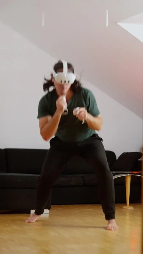 Engaging in a Virtual Reality Workout thats Thrilling and Full of Action and Stock Footage 304811257