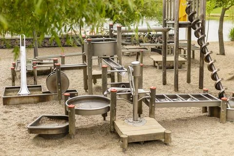 This engaging water play structure features various channels, slides, and wat Stock Photos