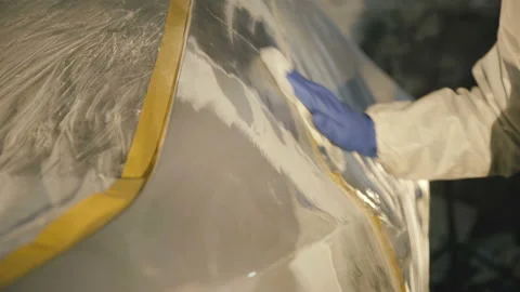 The engeneer wipes car surface. 4K Video stock 86829597