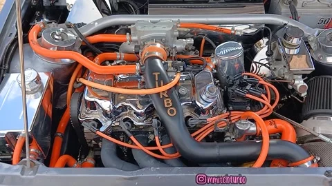 The engine of a 1989 Ford Escort 1600 Cabriolet Stock Footage 340531723