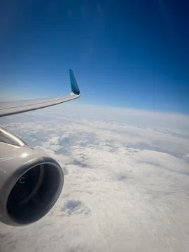 The engine of an aeroplane in flight above the clouds Stock Photos