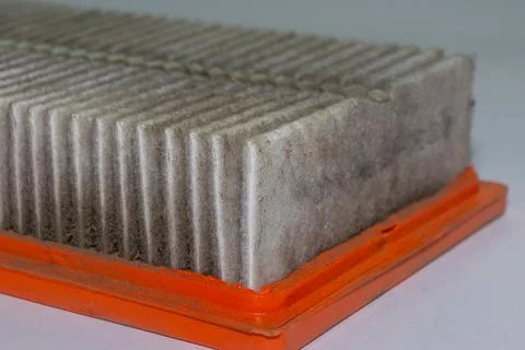 Engine air filter clogged with debris and soot allows enough air to pass thro Stock Photos