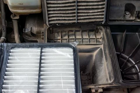 Engine Air Filter Replacement - New Clean Filter Installed After Removing Dirty Stock Photos