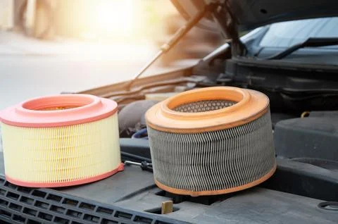 The engine air filter is sitting there, waiting to be replaced. Stock Photos