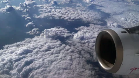 An engine of an airplane flying above the clouds Video stock 243442988