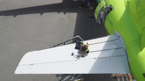 Engine and chassis of the passenger airplane under heavy maintenance. Engineer Stock Footage 84436772
