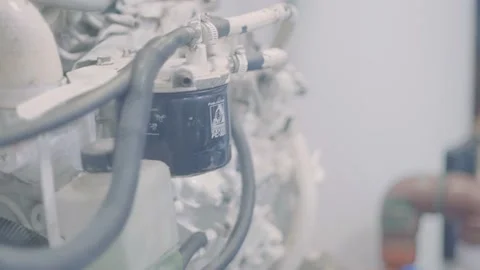 An engine and devices with tubes and knobs are part of the engine room of 動画素材 144246166