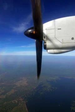 Engine and propeller of the plane on the blue sky Stock Photos