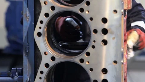Engine assembly. Worker cleans the engine. Worker wipes the engine cylinders 動画素材 78368711