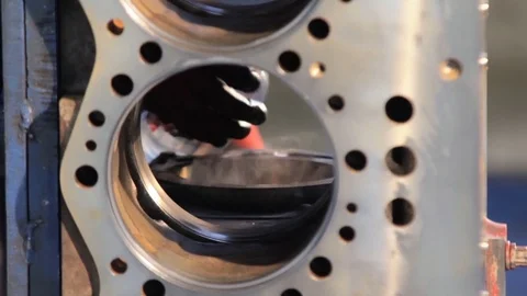 Engine assembly. Worker cleans the engine. Worker wipes the engine cylinders 動画素材 78368904