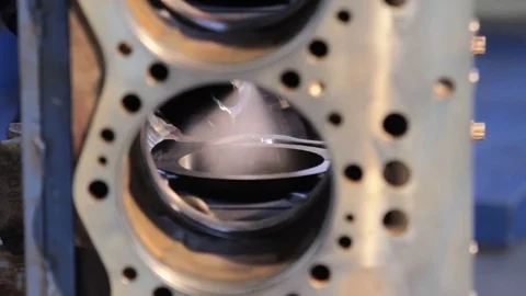 Engine assembly. Worker cleans the engine. Worker wipes the engine cylinders 動画素材 78496146