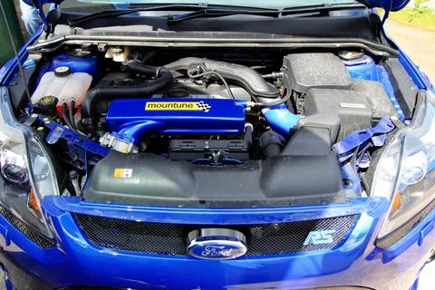 Engine bay of a modified blue Ford Focus RS car Stock Photos