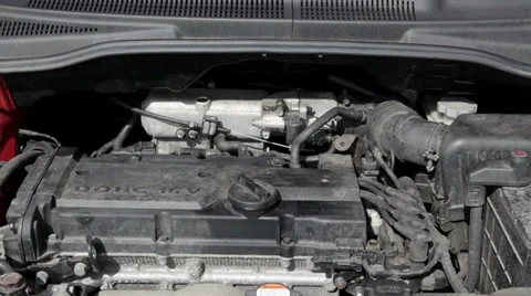 Engine bay, starting the motor of a compact car Видео 36814420