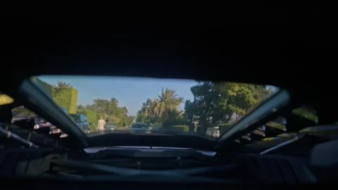 Engine bay view from Lamborghini Huracan supercar driving on the street Stock Footage 277219474
