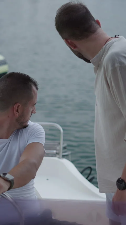 An engine is being started by two spanish friends Stock Footage 264923725