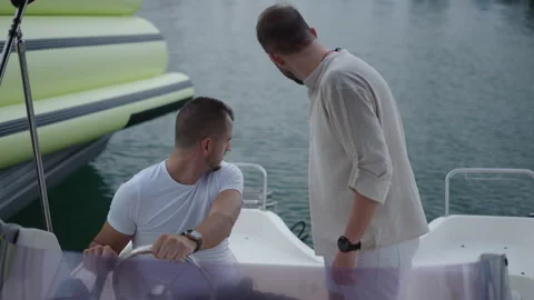 An engine is being started by two spanish friends Stock Footage 265907397