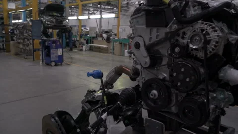 The engine block moves towards the car assembly conveyor. Car factory. Stock Footage 163023740
