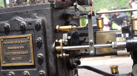 Engine block on old steam engine people passing by Stock Footage 63204624