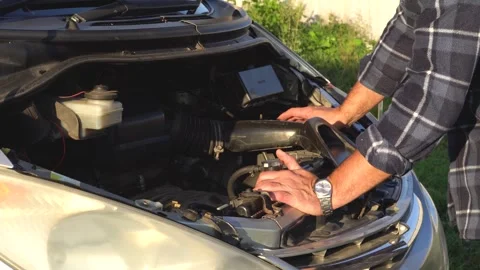 Engine compartment and men's hands 4K Stock Footage 325988475