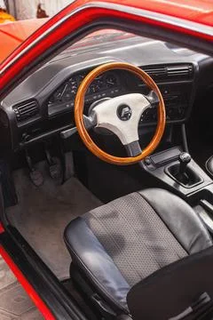 The engine compartment of a BMW e30 with an installed motor M20B20 Stock Photos