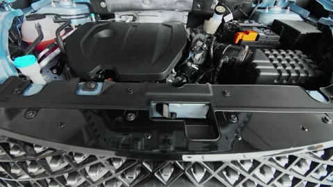 The engine compartment of a new car. Under the Hood, Engineering Brilliance of a Stock Footage 257762418