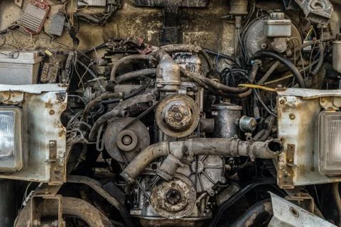 Engine compartment of an old car. Open hood with old cars details. Stock Photos