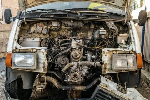 Engine compartment of an old car. Open hood with old cars details. Stock Photos