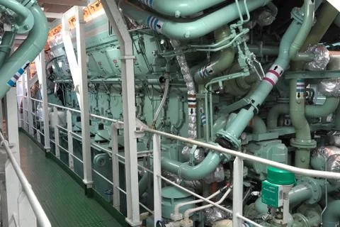 The engine compartment of the ship. Engine and steering equipment. Stock Photos